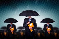 businessmen in rain igor fotolia com