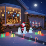 Stark beleuchtete Weihnachtsdeko an Hausfassade und Vorgarten mit beleuchtetem Rentierschlitten im Fenster, aufblasbaren Schneemännern, Weihnachtsmann und leuchtenden Geschenken im Schnee bei Nacht.